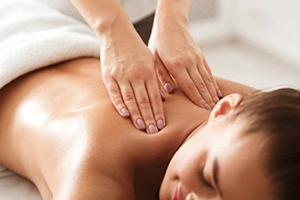 Massage Therapist massaging a patient